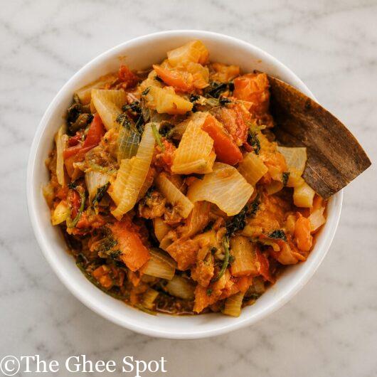 Spicy stewed tomatoes with onion, cilantro, and peppers into a delicious tamatar sabji