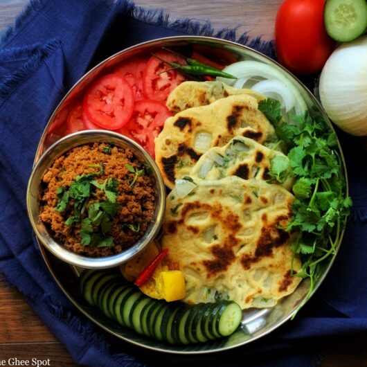 Onion, cilantro, and chili pepper baked into a fluffy leavened flatbread. Kulchas are delicious and easy to make.