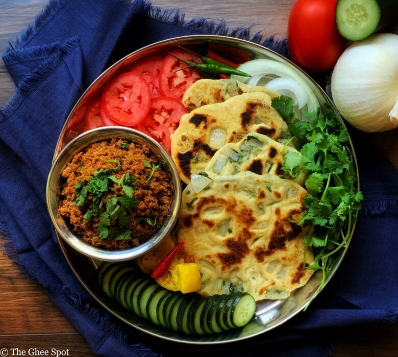 Onion, cilantro, and chili pepper baked into a fluffy leavened flatbread. Kulchas are delicious and easy to make.