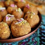 Besan Ladoo made with roasted gram flour, almonds, cardamom, and butter. This holiday dessert is sweet and delicious.