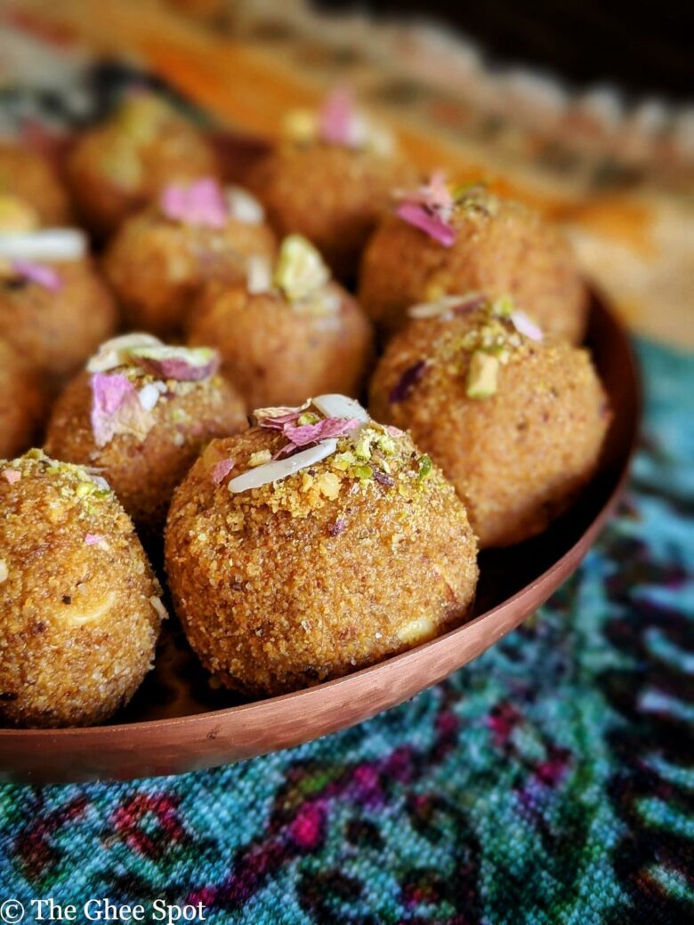 Besan Ladoo made with roasted gram flour, almonds, cardamom, and butter. This holiday dessert is sweet and delicious.