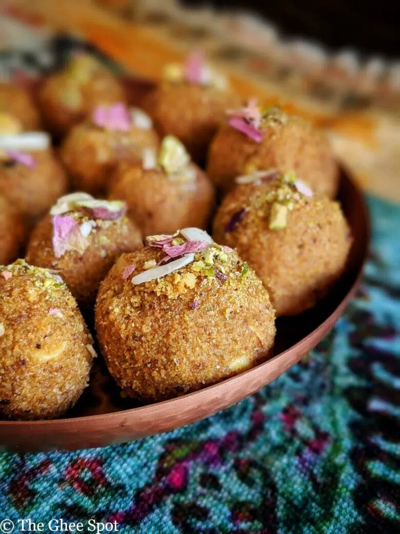 Besan Ladoo made with roasted gram flour, almonds, cardamom, and butter. This holiday dessert is sweet and delicious.