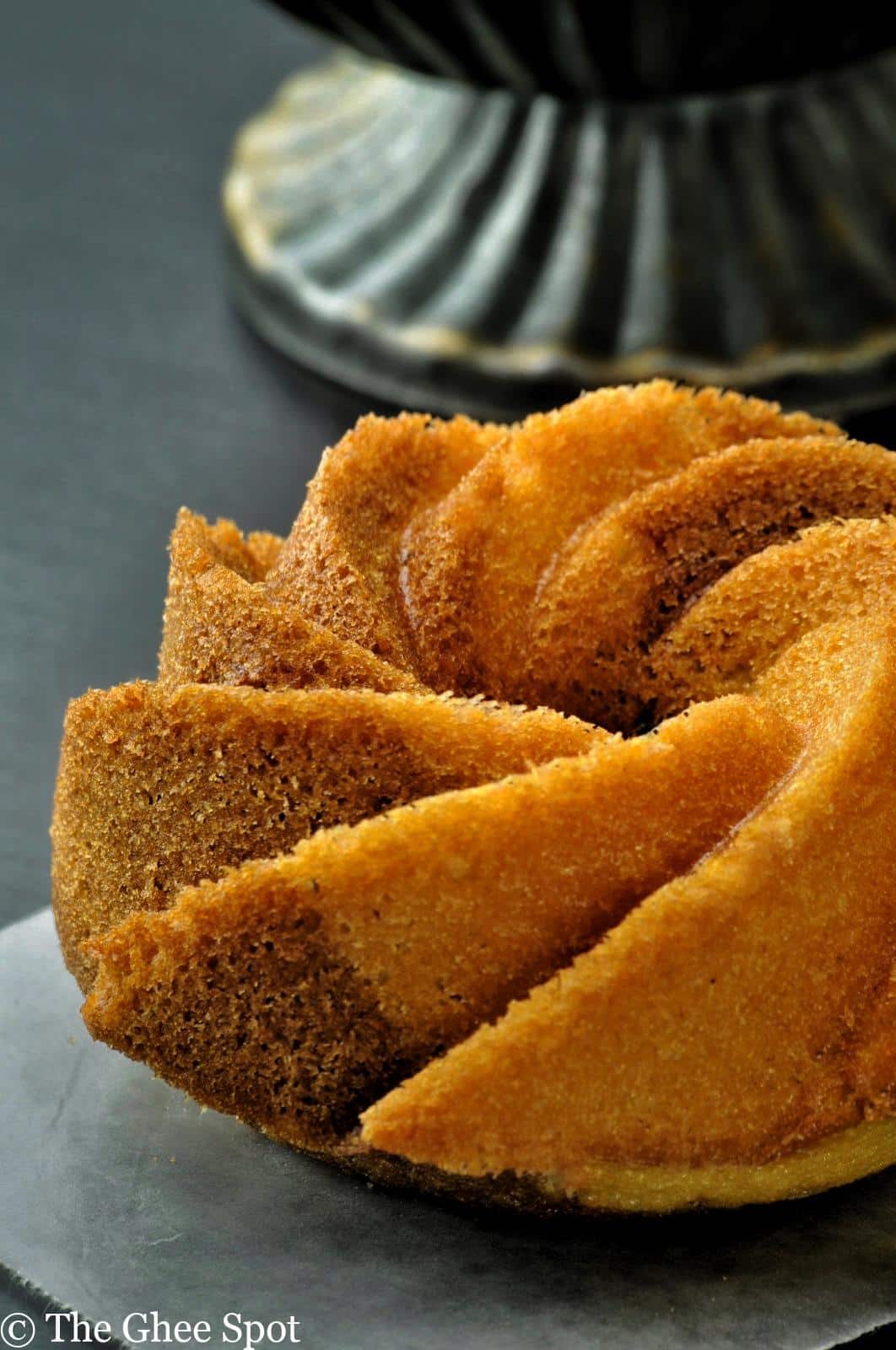 This is a light, airy, spongy, coffee, cocoa, orange, and cardamom bundt cake.