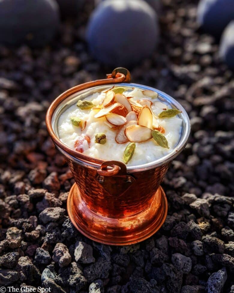 Creamy, sweet, kheer (rice pudding) cooked with whole milk, sugar, cardamom, topped with sliced almonds.