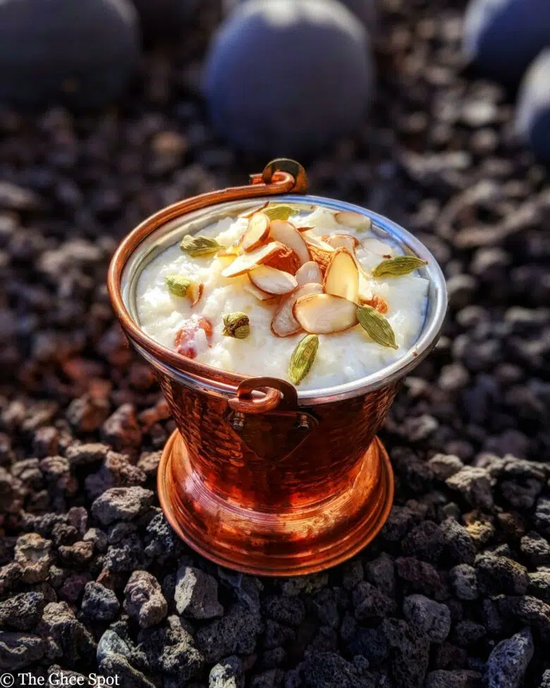 Creamy, sweet, kheer (rice pudding) cooked with whole milk, sugar, cardamom, topped with sliced almonds.