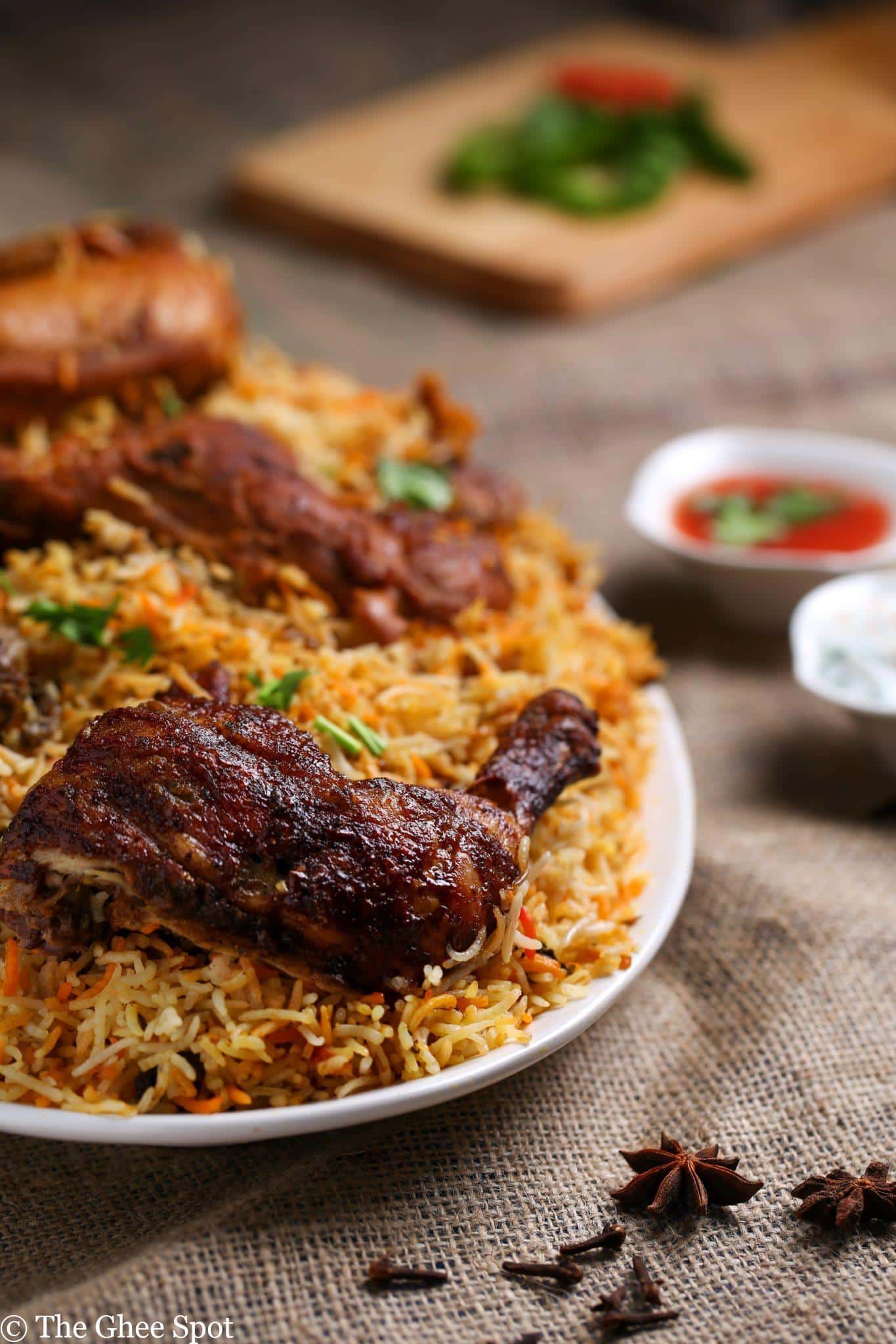 Savory marinated chicken layered with rice and then cooked together in an aromatic blend of spices