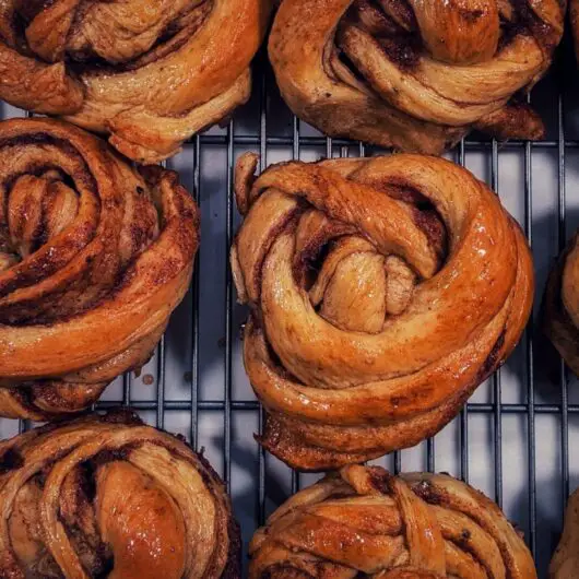Glazed cardamom cinnamon buns. Light, spongy, and perfect for breakfast or brunch.