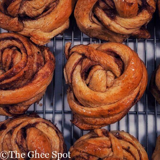 Glazed cardamom cinnamon buns. Light, spongy, and perfect for breakfast or brunch.