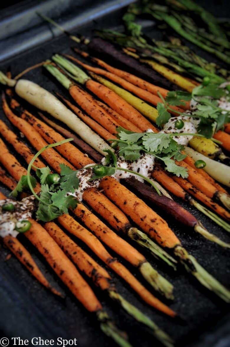 Savory grilled carrots with a cumin yogurt are perfect for an appetizer, snack, or side to a midweek or Thanksgiving dinner.