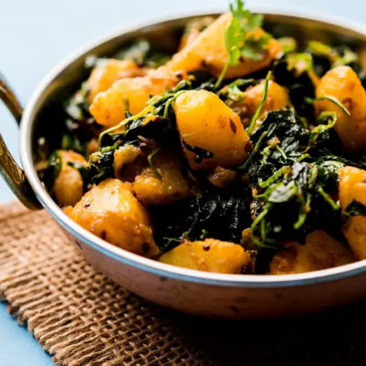 Savory and earthy fenugreek stir fried with potatoes. Methi Aloo is fast and easy