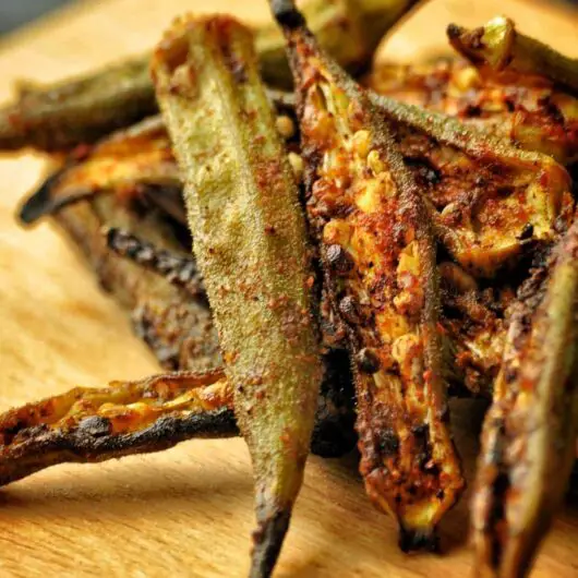 Crispy fired okra chips covered in traditional Punjabi Spices