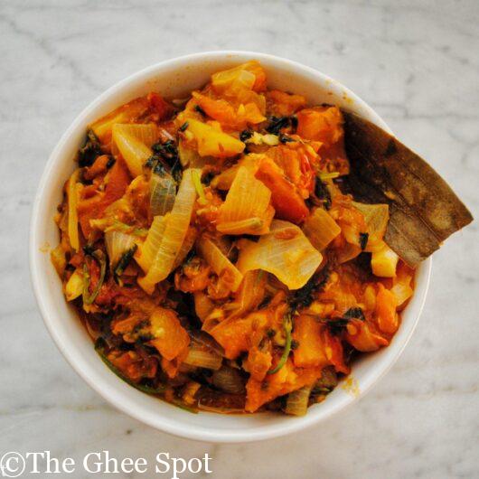 Spicy stewed tomatoes with onion, cilantro, and peppers into a delicious tamatar sabji