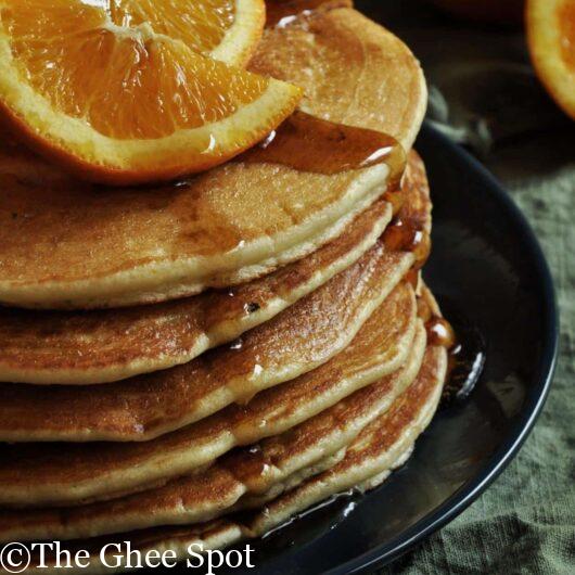 fresh orange juice and cardamom make these pancakes light and delicious.