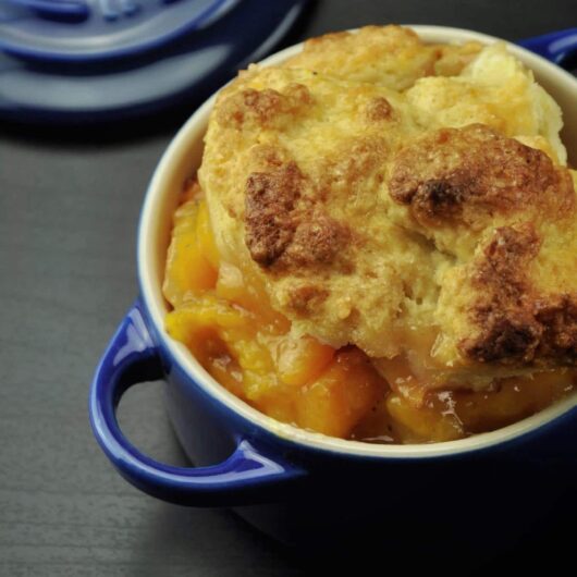 Rich, warm, and sweet peach cobbler with cardamom