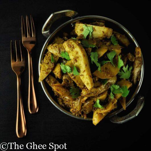 Sautéed arbi with savory herbs and spices.