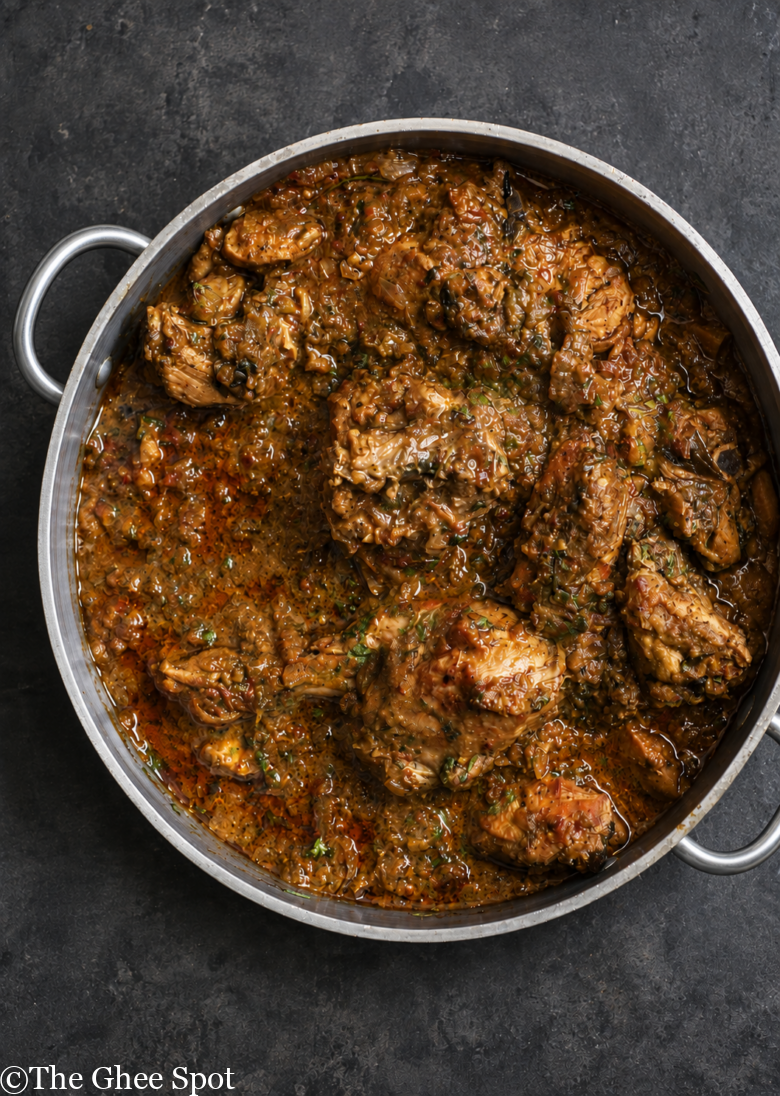 Savory and delicious slow cooked Punjabi Chicken Curry with bone-in chicken, cumin, coriander, cardamom, onions, and more.