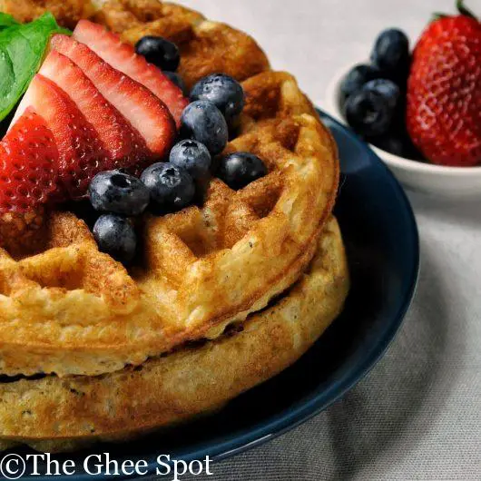 Delicious yeasted waffles with strawberries and blueberries