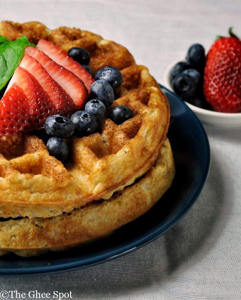 Delicious yeasted waffles with strawberries and blueberries