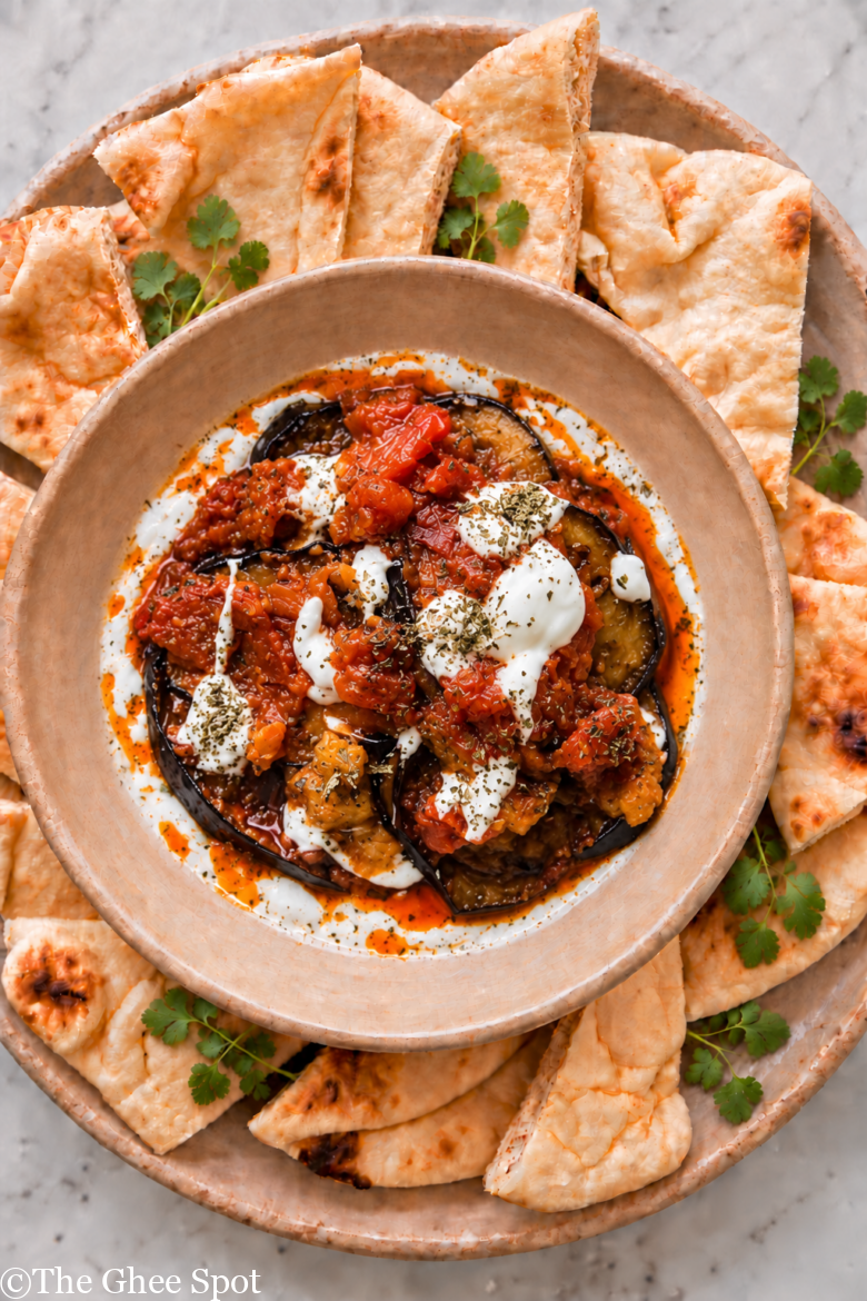 Stewed eggplant, savory tomato sauce, topped with a garlicky yogurt sauce and crushed mint.