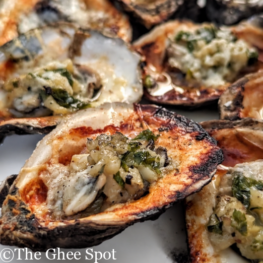 This recipe for grilled oysters with garlic butter and pecorino is perfect for any gathering.