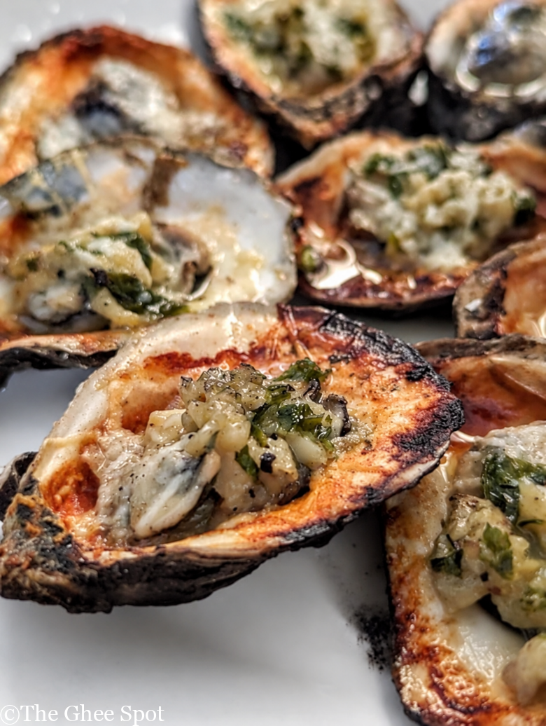 This recipe for grilled oysters with garlic butter and pecorino is perfect for any gathering.