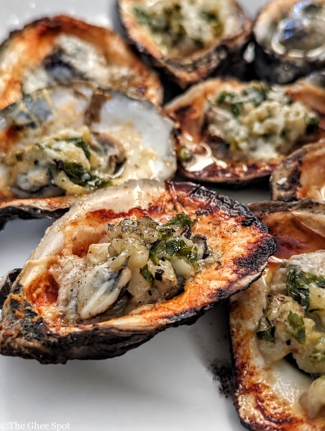 This recipe for grilled oysters with garlic butter and pecorino is perfect for any gathering.
